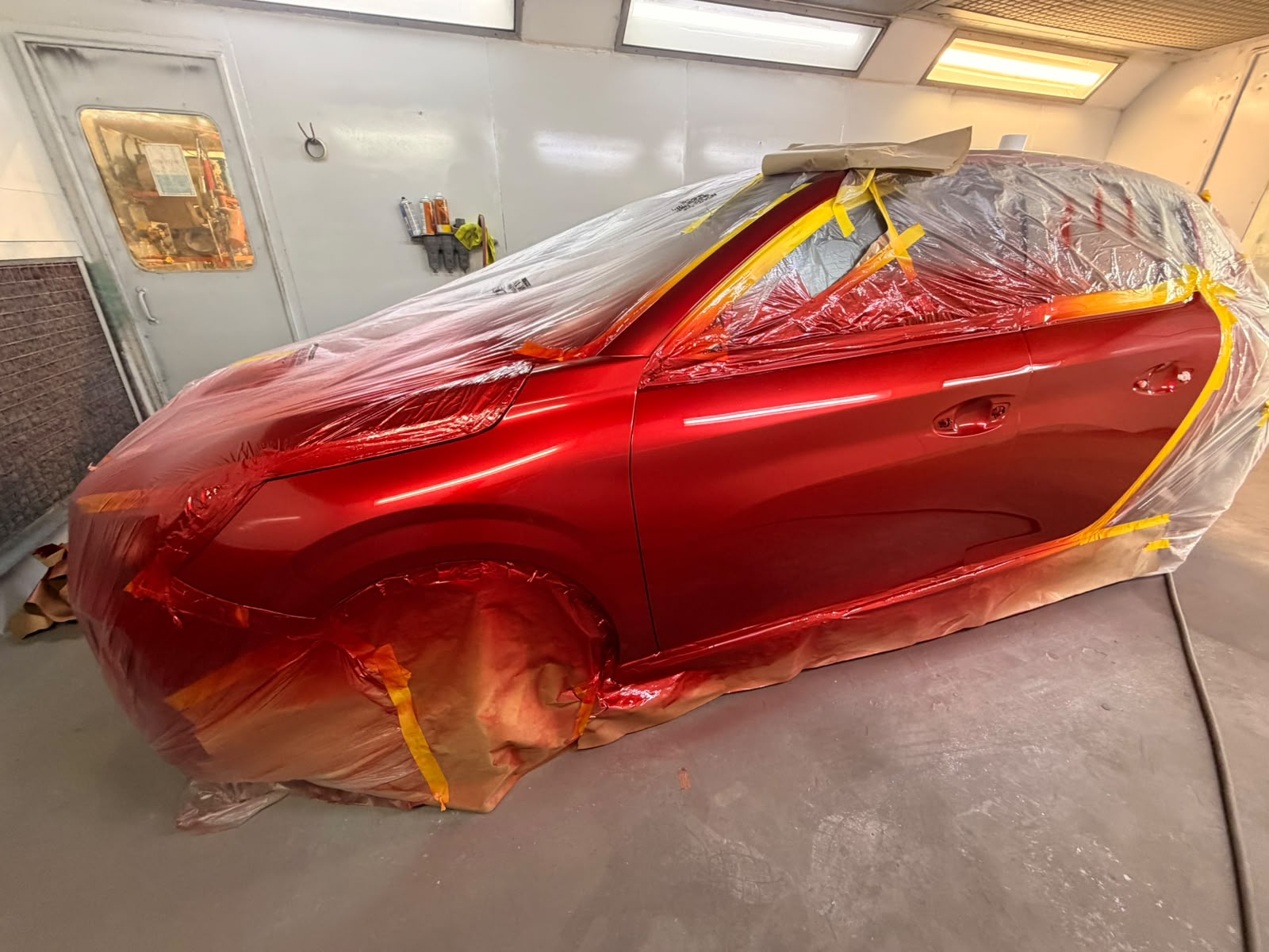 Freshly painted red vehicle at the Weir Expert Repairs workshop